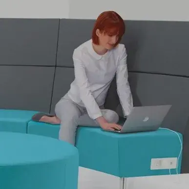 person working with a laptop on Global furniture product